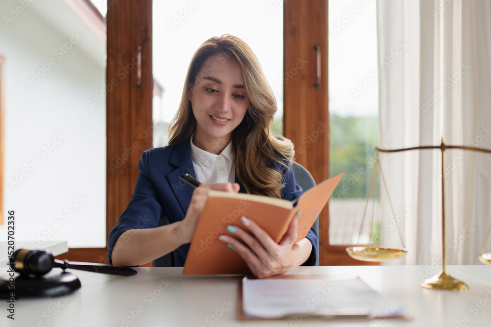 Lawyer business woman reading law book and agreement contract. Lawyer business woman reading law book and agreement contract.