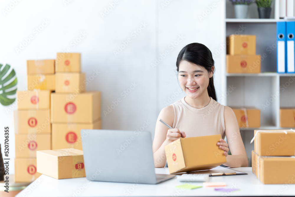 Starting small businesses SME owners female entrepreneurs check online orders to prepare to pack the boxes, sell to customers, sme business ideas online. Starting small businesses SME owners female entrepreneurs check online orders to prepare to pack the boxes, sell to customers, sme business ideas online.