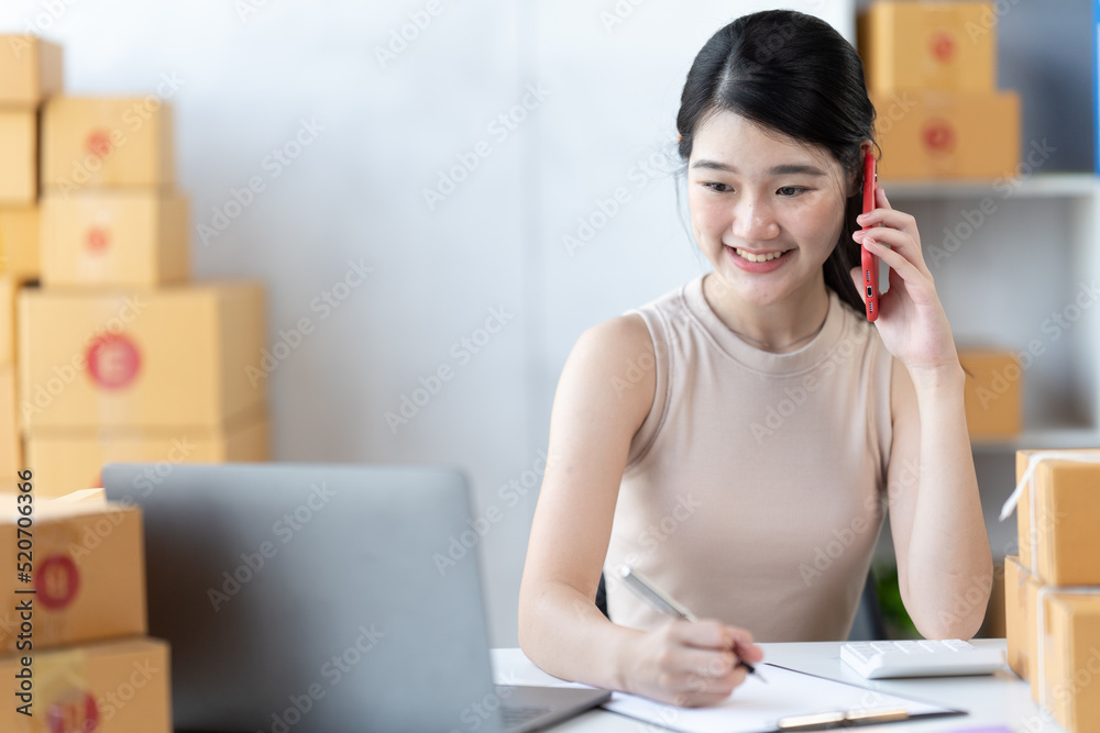 Starting small businesses SME owners female entrepreneurs check online orders to prepare to pack the boxes, sell to customers, sme business ideas online.