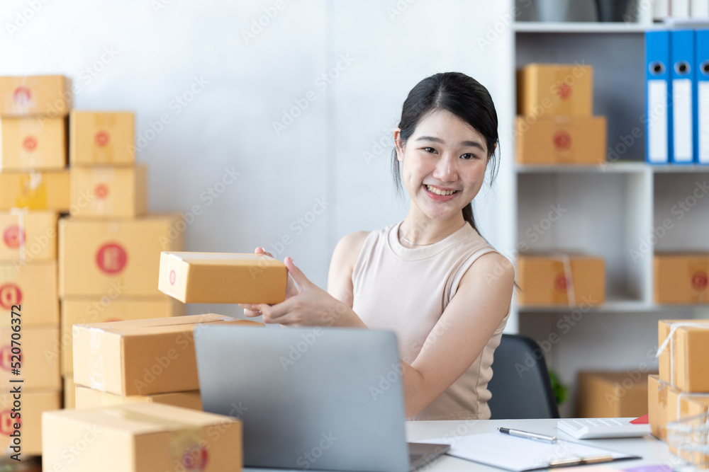 Starting small businesses SME owners female entrepreneurs check online orders to prepare to pack the boxes, sell to customers, sme business ideas online.