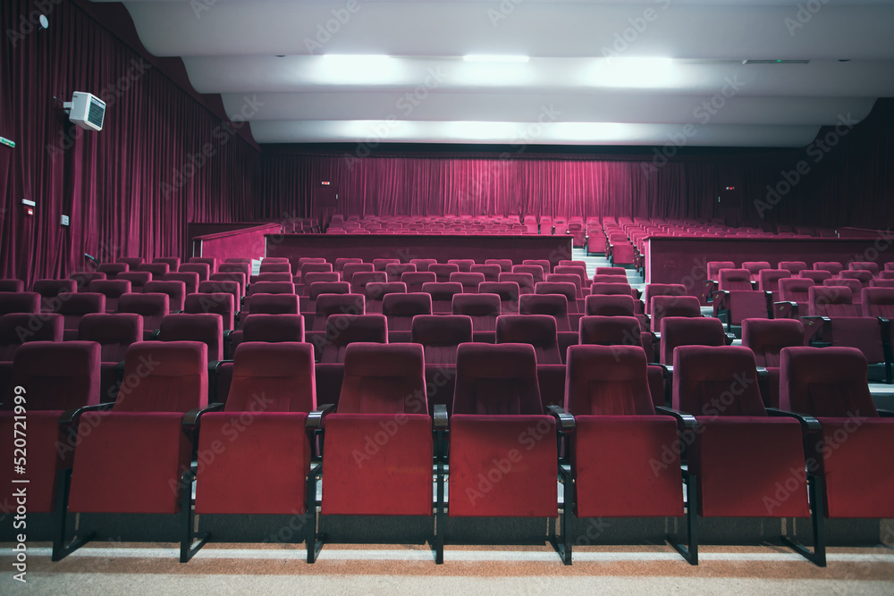 Empty red chairs for audience in the theater Empty red chairs for audience in the theater