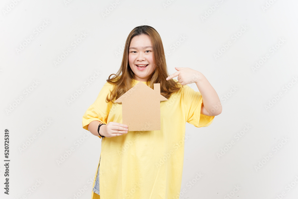 Holding Cutout House of Beautiful Asian Woman wearing yellow T-Shirt Isolated On White Background Holding Cutout House of Beautiful Asian Woman wearing yellow T-Shirt Isolated On White Background