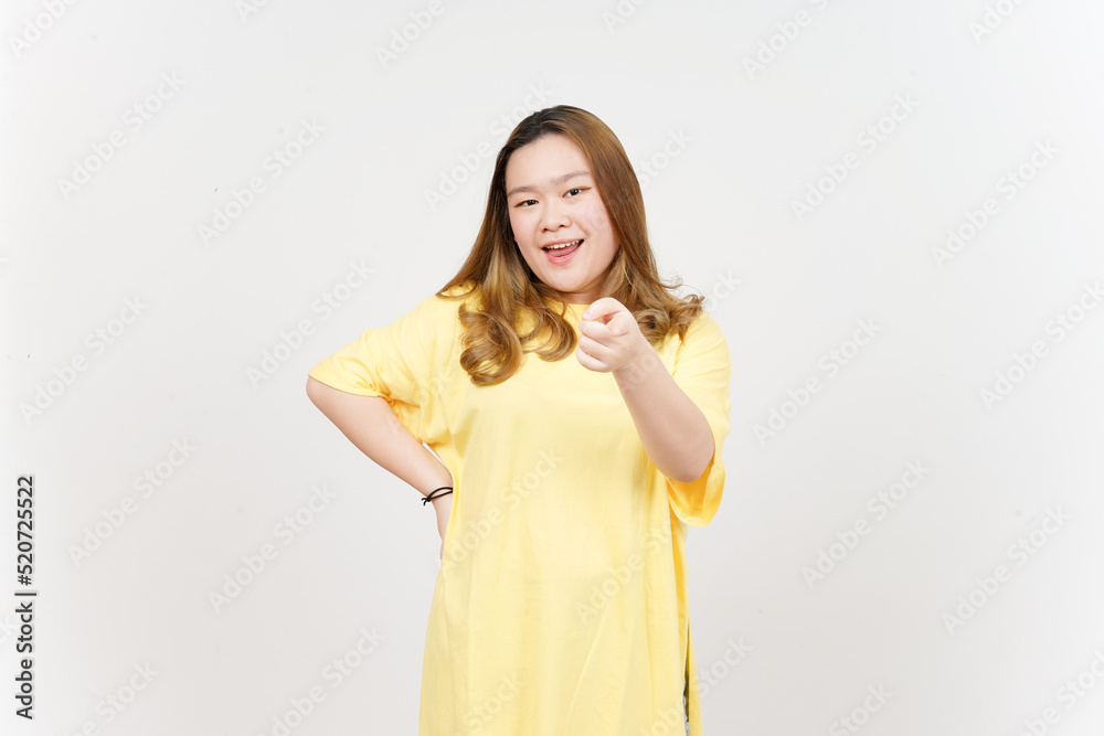 Smiling and pointing at you of Beautiful Asian Woman wearing yellow T-Shirt Isolated On White Smiling and pointing at you of Beautiful Asian Woman wearing yellow T-Shirt Isolated On White