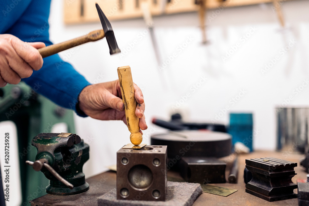 Fototapeta premium Using Hammer in Jewelry Atelier