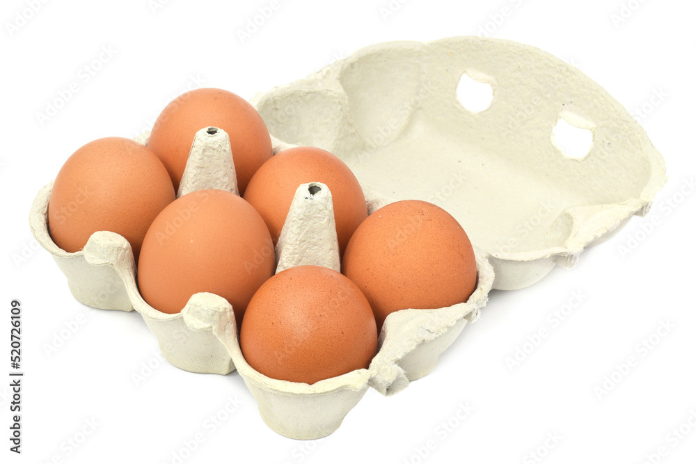 Six brown fresh raw chicken eggs in package or carton open isolated on white