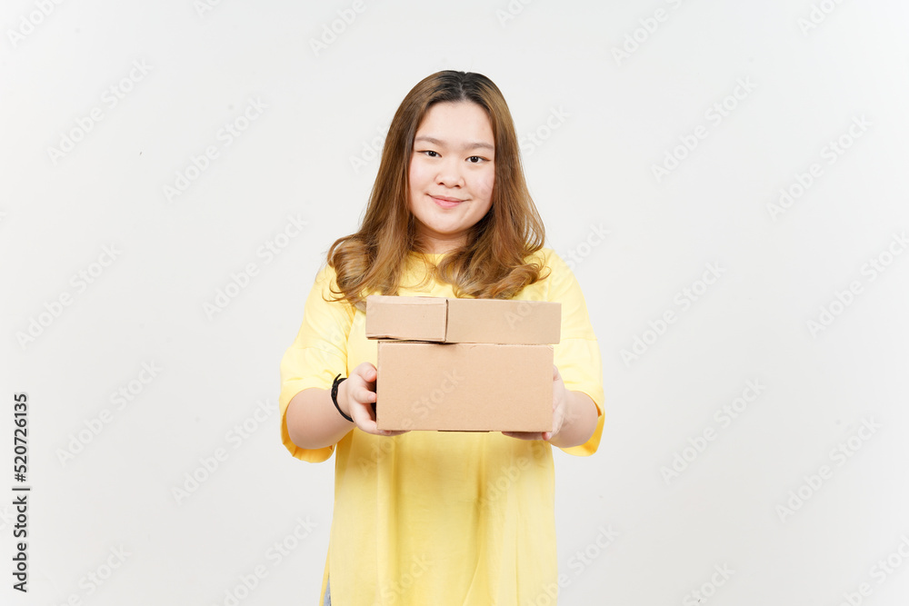 Holding Package Box or Cardboard Box of Beautiful Asian Woman wearing yellow T-Shirt Holding Package Box or Cardboard Box of Beautiful Asian Woman wearing yellow T-Shirt