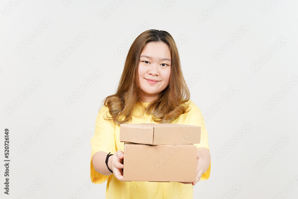 Holding Package Box or Cardboard Box of Beautiful Asian Woman wearing yellow T-Shirt Holding Package Box or Cardboard Box of Beautiful Asian Woman wearing yellow T-Shirt