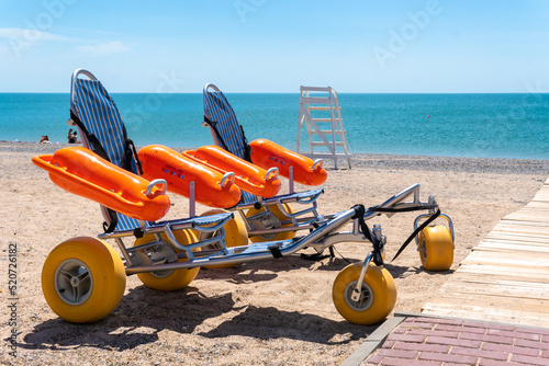 Swimming stroller bathing wheelchair people handicapped disabled disabilities young ramp, concept move handicap for child from moms casual, daughter guilty. Happy little loneliness,