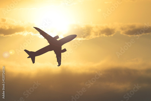 Silhouette of a passenger plane in the sky. Travel and travel ideas around the world.