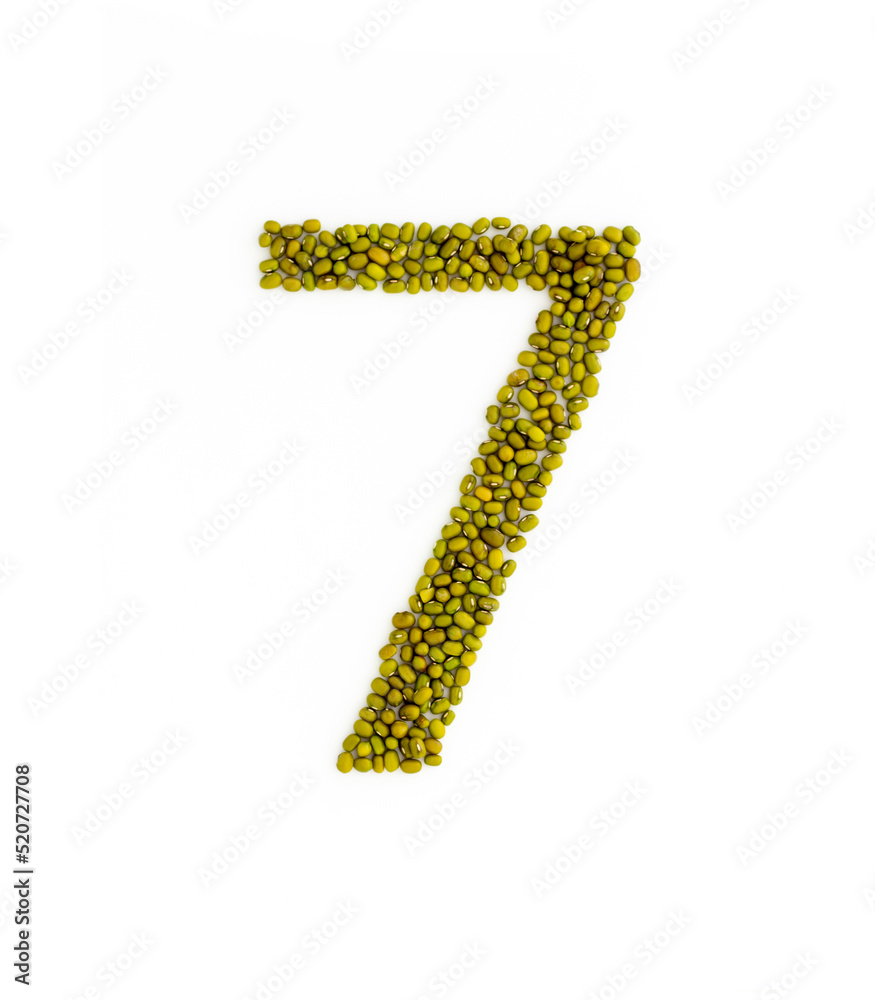 Number 7 made from mung beans. Green mung bean font. Alphabet made from green gram . White background. Dry green maash seeds. Number 7 made from mung beans. Green mung bean font. Alphabet made from green gram . White background. Dry green maash seeds.