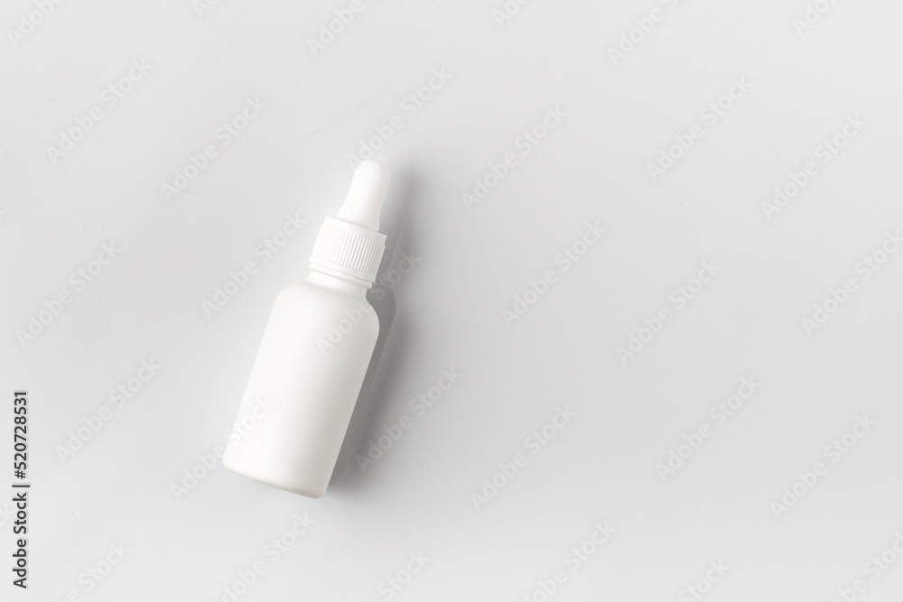 Mockup of beauty cosmetic makeup bottle with pipette product on white background.