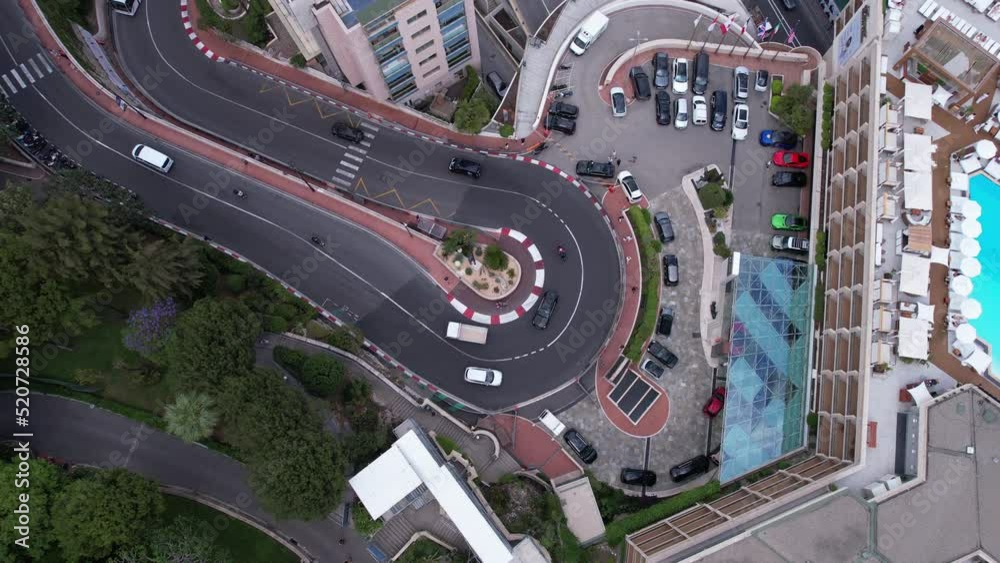 Birds Eye Aerial View of Traffic in Monte Carlo, Monaco. Curve on Famous Formula One Grand Prix Circuit, Top Down Drone Shot
