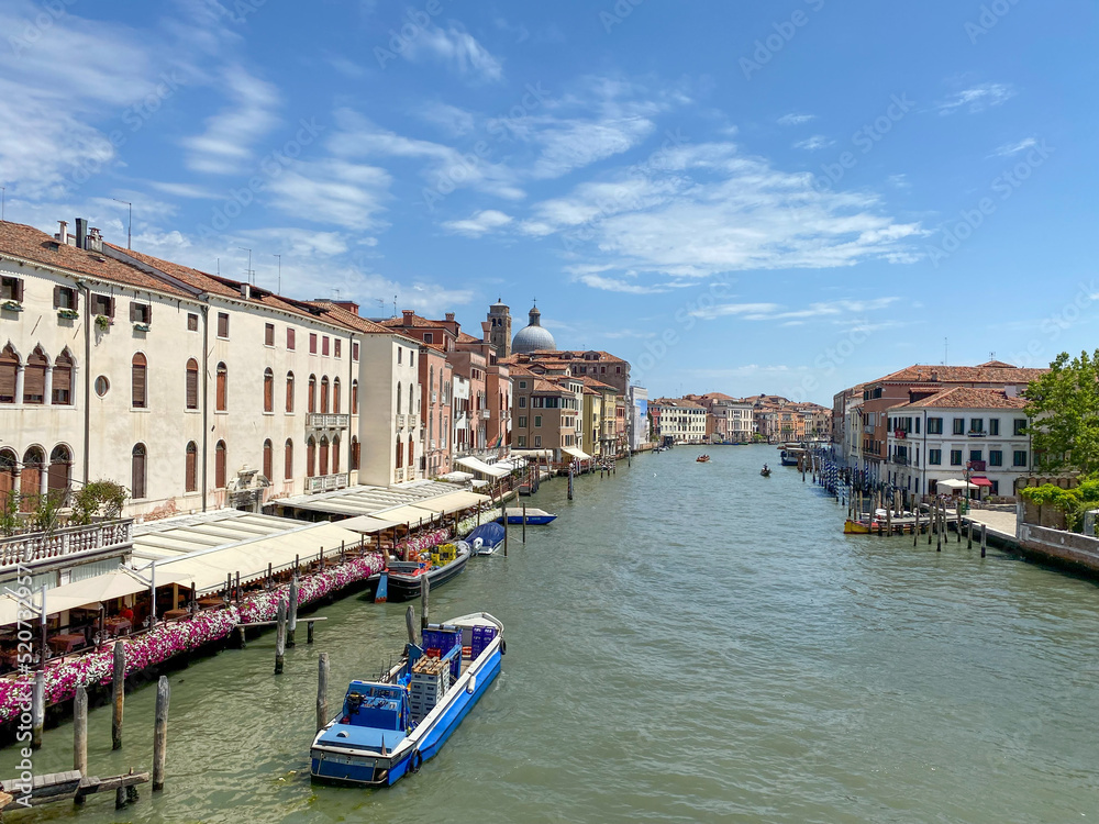 The view on Grand Canal at sunny day with barge, Venice, Italy The view on Grand Canal at sunny day with barge, Venice, Italy
