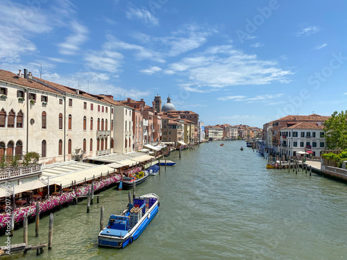 The view on Grand Canal at sunny day with barge, Venice, Italy