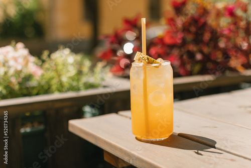 Glass of melon lemonade in a cafe outdoors. Summer drinks.