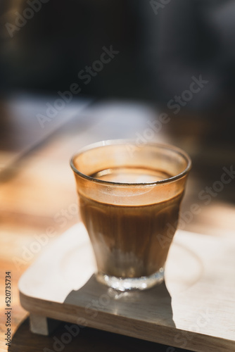 A glass of espresso shot over cold fresh milk. Dirty Coffee, Coffee menu, Milk Coffee