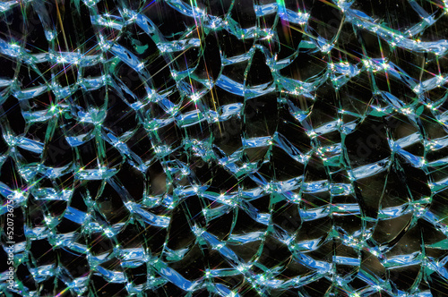 broken tempered glass texture background with glitter