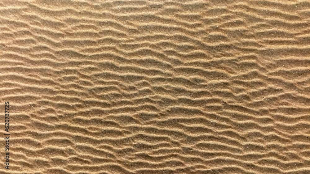 Unique patterns in beach sand caused by wind; overhead slider shot Unique patterns in beach sand caused by wind; overhead slider shot