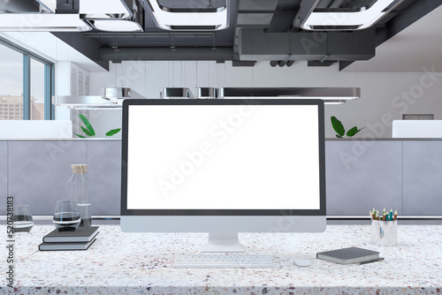 Close up of creative marble designer desktop with clean white mock up computer monitor and supplies in modern coworking office with partition. 3D Rendering.