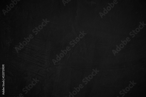 Black concrete stone texture for background in black. Cement and sand grey dark detail covering. 