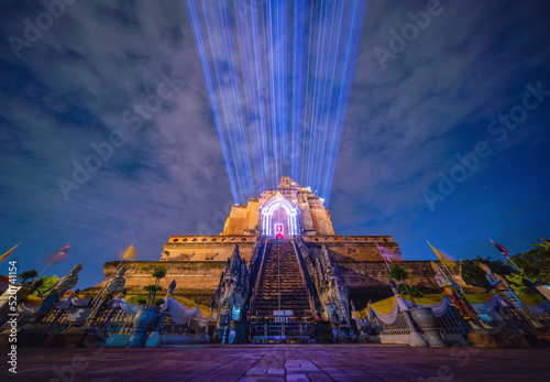Temple in night, Wat Chedi Luang with laser lights show the lost pagoda from the collapse, Chiang Mai, Thailand. skyline,Old temple area at night.