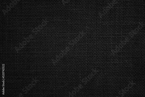 Black Hemp rope texture background. Haircloth wale black dark cloth wallpaper. Rustic sackcloth canvas fabric texture in natural.
