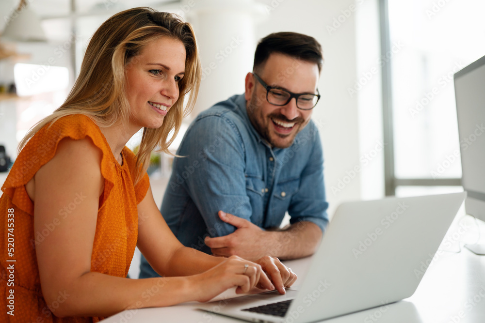 Programmers cooperating at IT company developing apps Programmers cooperating at IT company developing apps