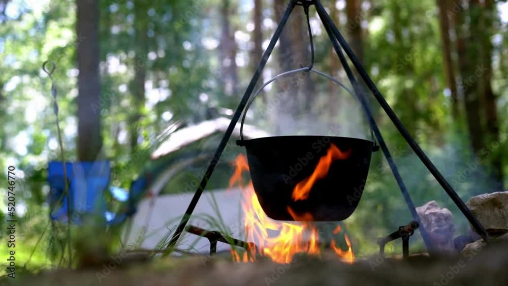 Pot cooking on a fire. Tourist trip. Camping Pot cooking on a fire. Tourist trip. Camping