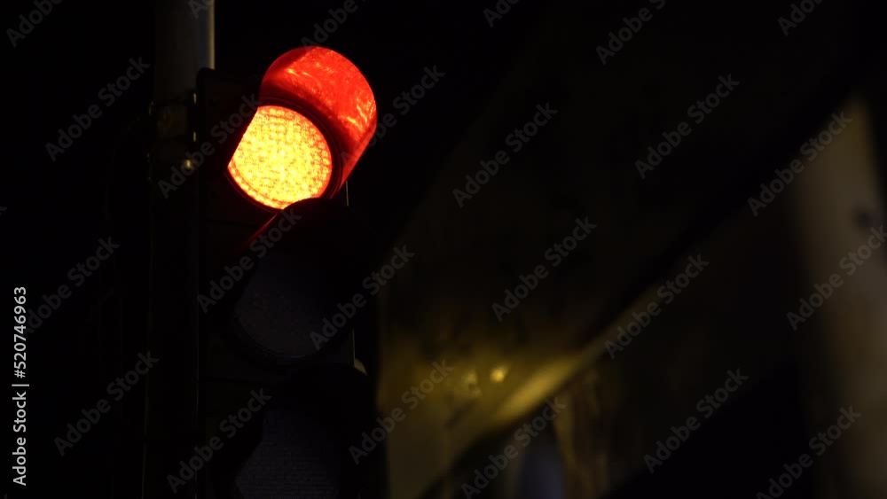 Car traffic lights turning green from red and turning red from green. Long shot in a big city