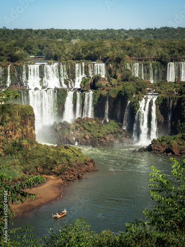 Tourist boat exploring Iguazu Falls on the border of Brazil and Argentina.