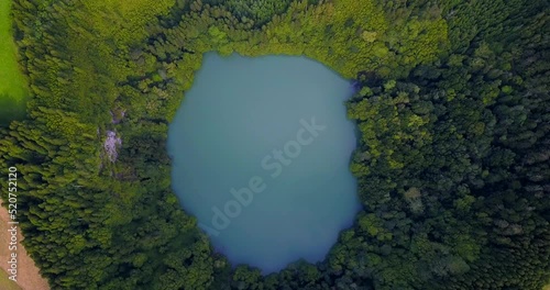 Lagoa do Congro bird eye vertical 4k drone view. High quality video of a lake in Azores islands photo