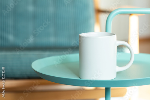 Obraz na płótnie White mug on the table. w salonie