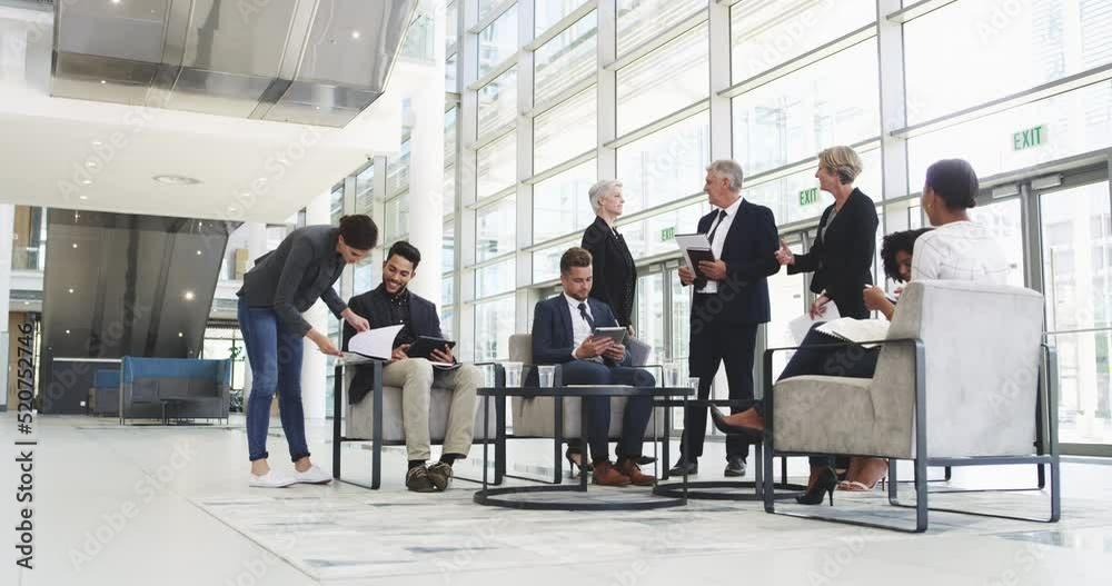 Team of senior staff and managers of a finance firm sitting and working in lobby. Elderly executive shaking hands with new colleagues. Group of corporate businesspeople at international conference Team of senior staff and managers of a finance firm sitting and working in lobby. Elderly executive shaking hands with new colleagues. Group of corporate businesspeople at international conference