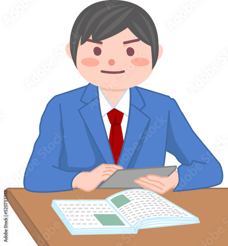 学校でタブレットを使って学習をする男子生徒