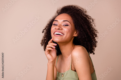 Photo of brunette millennial impressed lady wear khaki top isolated on beige color background
