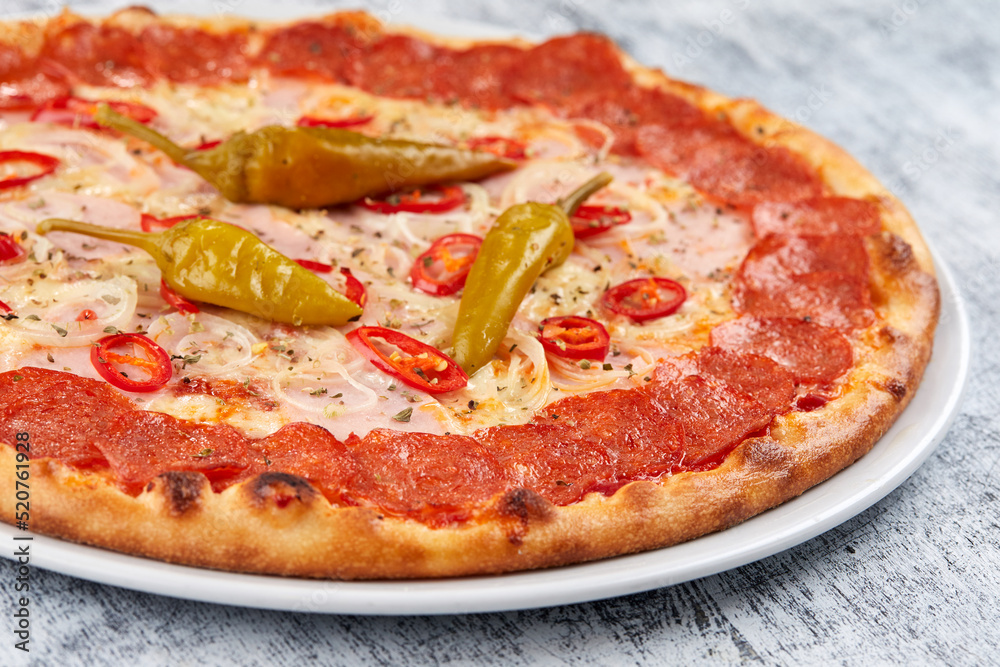 italian pizza on the white plate italian pizza on the white plate