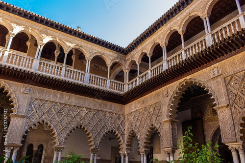 Seville, Spain, September 12, 2021: The Royal Palace of Seville (Real Alcazar). The Maidens Courtyard. The Mudejar of Pedro I on the ground floor and the Renaissance of the first monarchs.