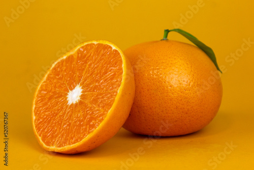 Juicy Orange fruit with leaf isolated. and Orang whole, slice, leaves on white. Orange slice with isolated on yellow background