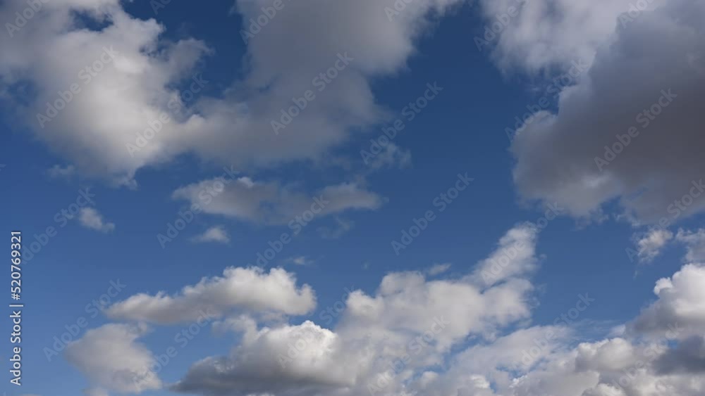 White clouds in the blue sky, timelapse video. Bright beautiful sky, copy space background. UHD 4k White clouds in the blue sky, timelapse video. Bright beautiful sky, copy space background. UHD 4k