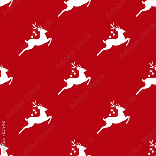 seamless winter pattern with white silhouette of deers with antlers and christmas tree toy balls on horns.