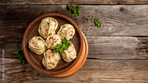 Traditional manti food on plate  top view. The concept of oriental cuisine. Uzbek food manty dumplings. Uzbek food. banner  catering menu recipe place for text
