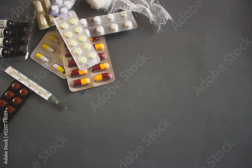 Fototapeta Naklejka Na Ścianę i Meble -  on a gray background pills medicine