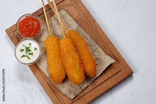 Korean Style Corn Dog with ketchup and  mayonnaise photo