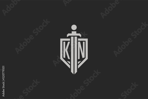 Letter KN logo with shield and sword icon design in geometric style
