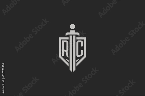 Letter RC logo with shield and sword icon design in geometric style