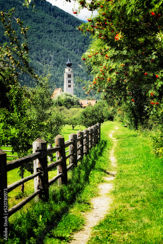 Riverside path to church of San Pancrazio beside the Mediaeval walled town of Stadt Glurns, Glorenza. Val Venosta, Italian Alps