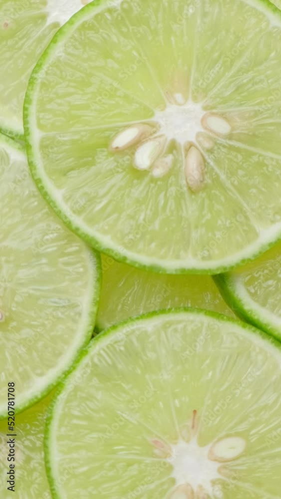 Vertical Resolution Video, Top view limes slices rotation, close up. Vertical Resolution Video, Top view limes slices rotation, close up.