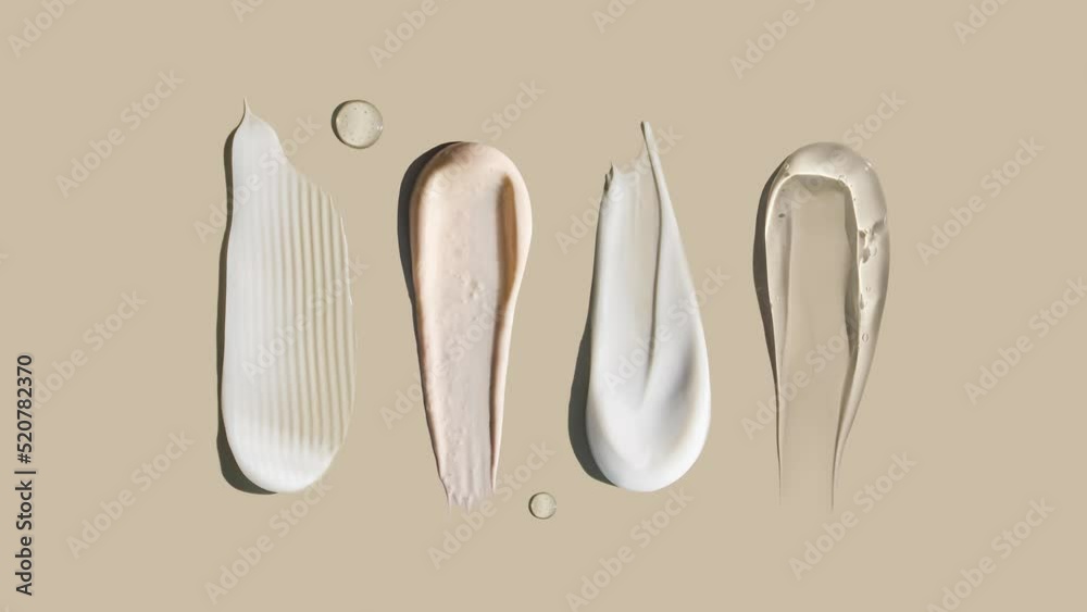 cosmetic smears cream texture on pastel background