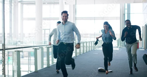 Playful, joking and fun business people running down a corridor or office building. Joyful, cheerful and funny corporate friends racing and being competitive. Team of employees playing after work