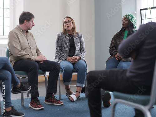People in group therapy session photo